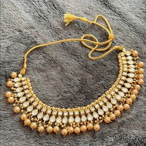Elegant Gold and Cream Kundan Necklace